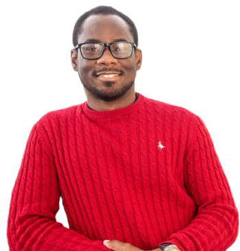 Black male smiling wearing a bright red jumper
